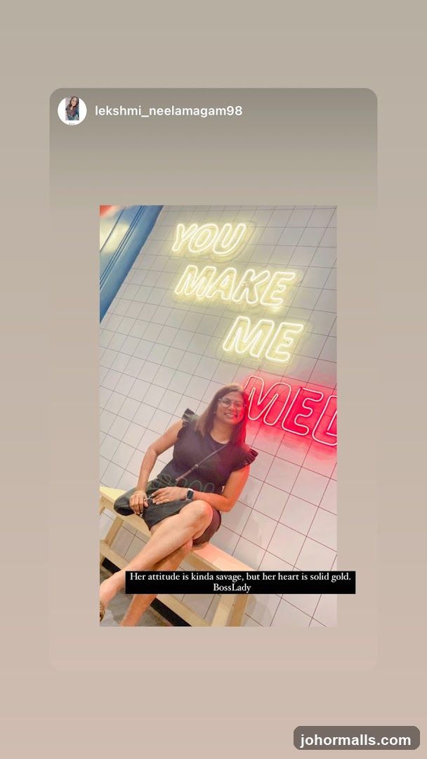 Woman Posing in Front of Neon Sign