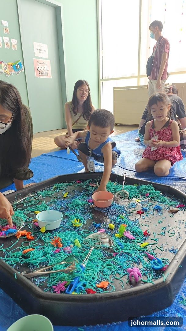 Children playing with sensory bin