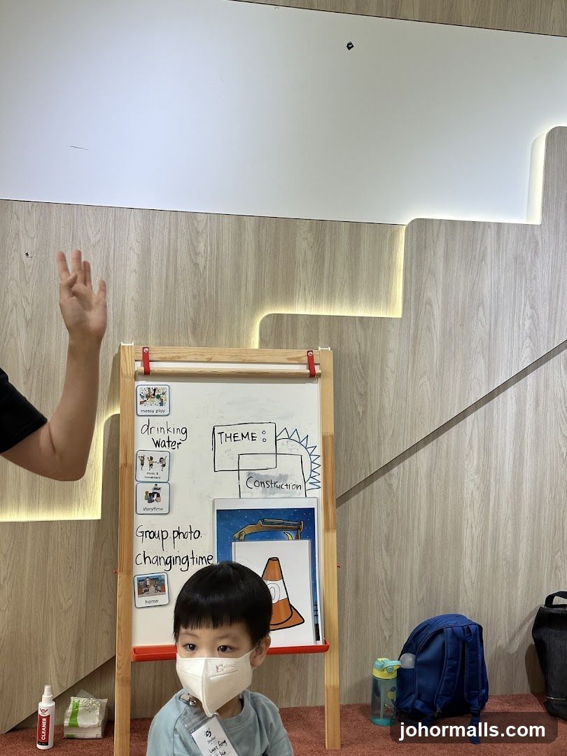 Classroom whiteboard with activities and a child
