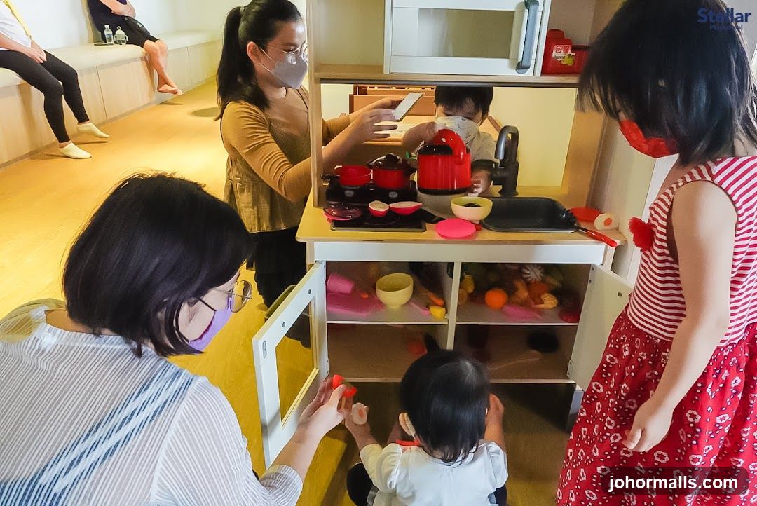 Children Playing with Toy Kitchen