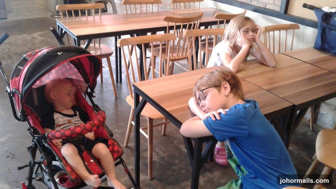 Children sleeping at tables