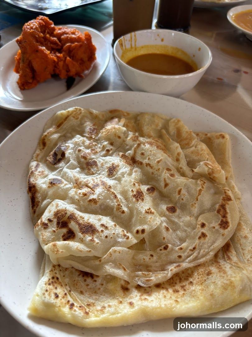 Roti Canai with Curry and Fried Chicken