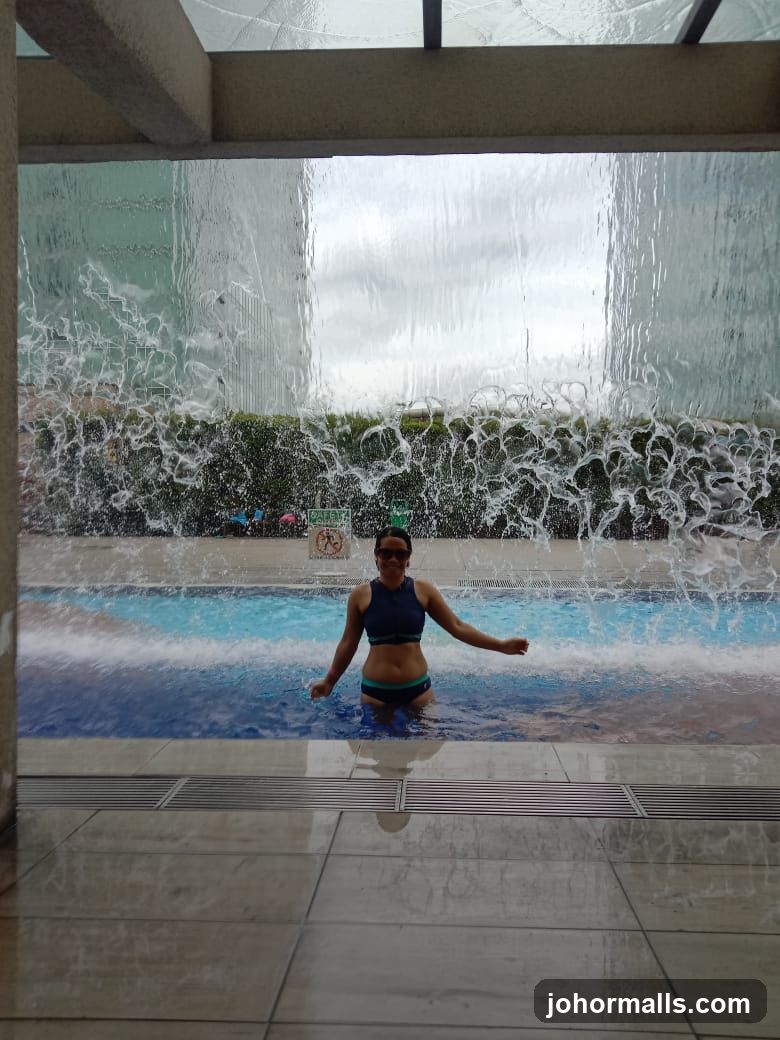 Woman in Pool with Waterfall