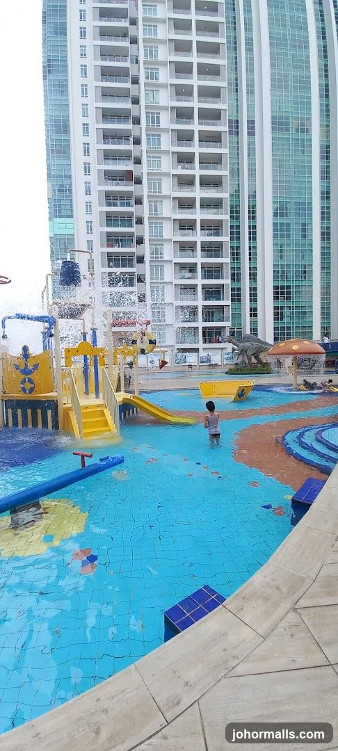 Water park with slides and dinosaur statues