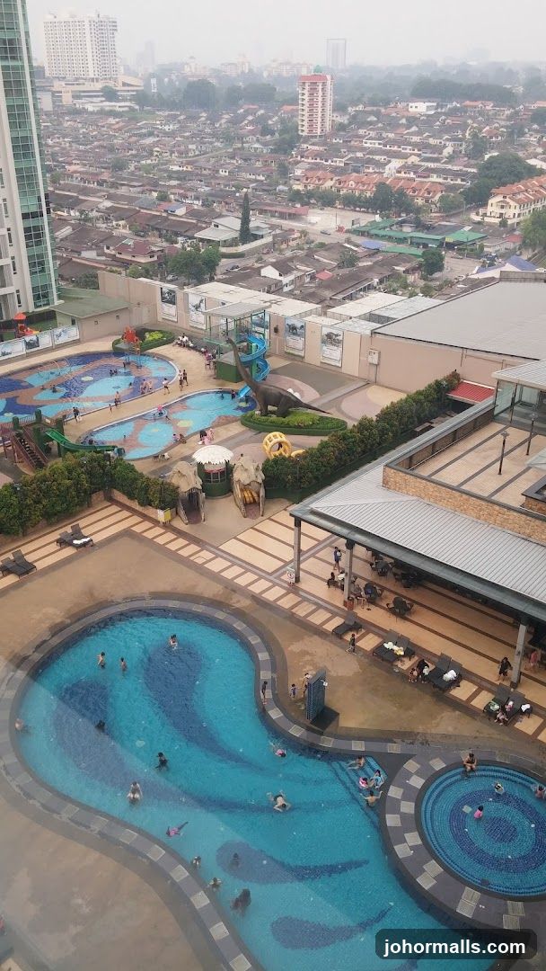 Resort Pool Area with Cityscape Background