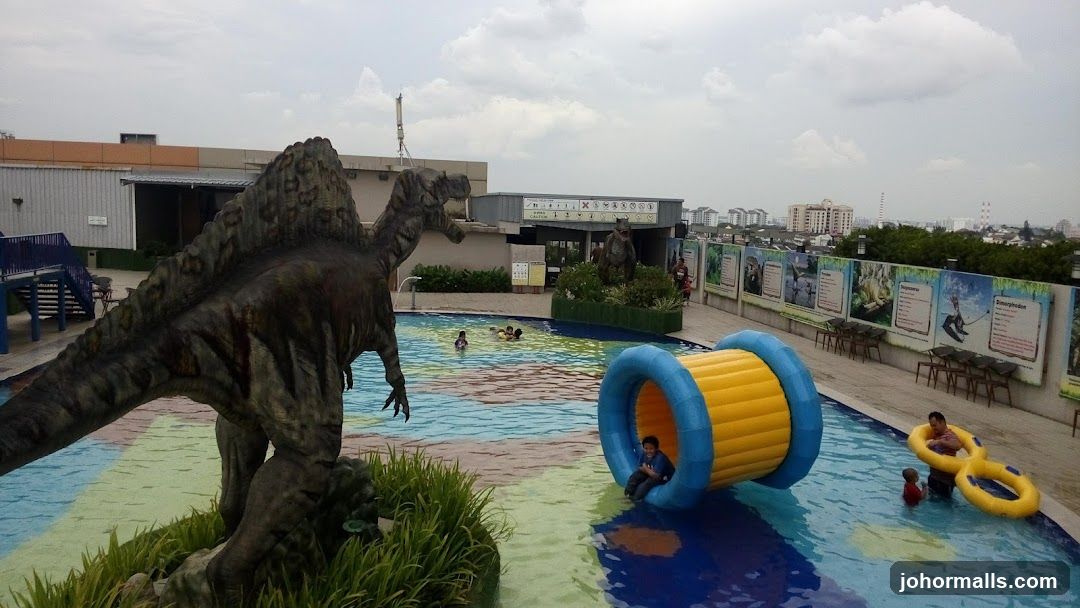 Rooftop Pool with Dinosaur Decorations