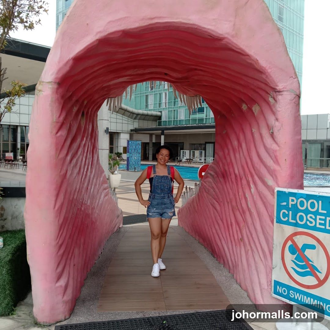 Woman Posing in a Whale Mouth Sculpture