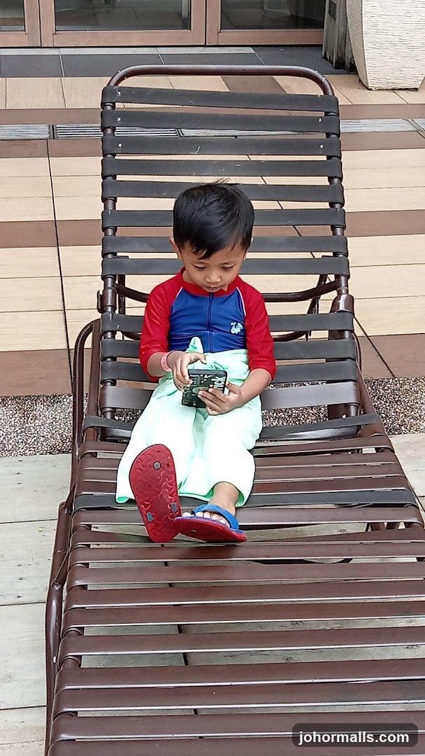 Boy on lounge chair