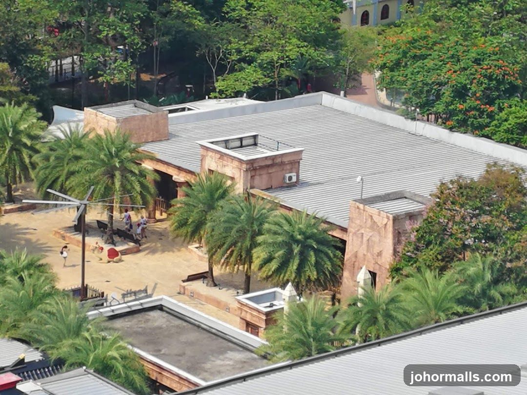 Outdoor area with people and palm trees