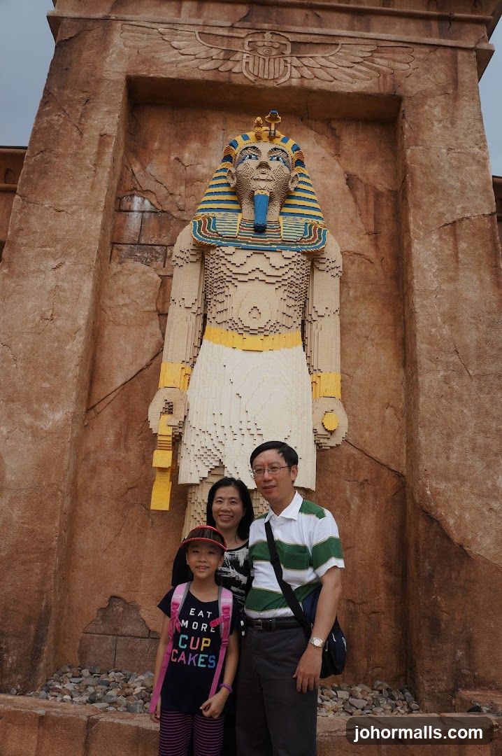 Family Poses in Front of Lego Pharaoh Statue