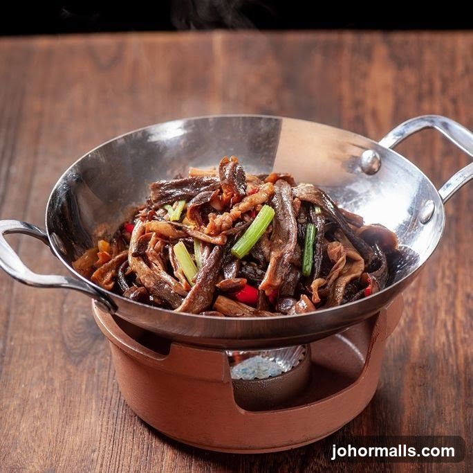 Stir-fried dish in a metal bowl