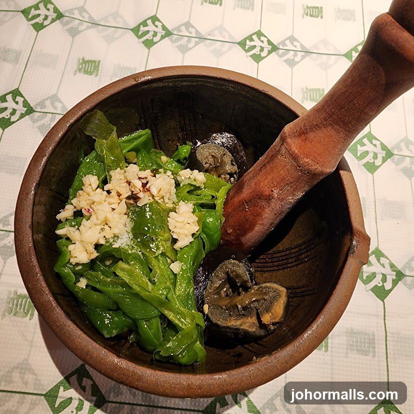 Mortar and Pestle with Green Peppers and Garlic