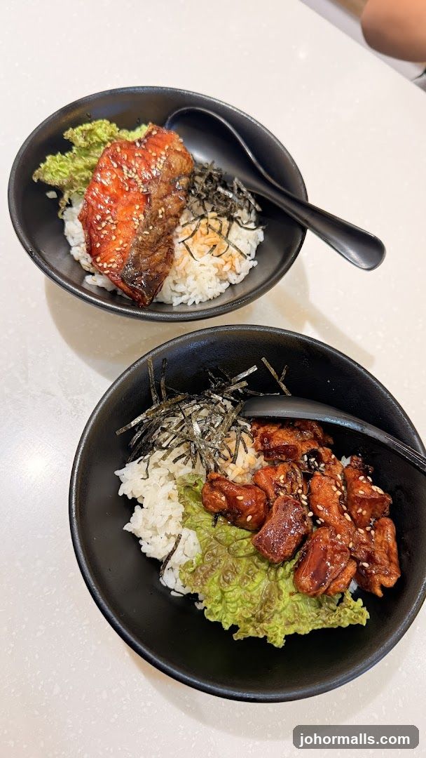 Two bowls of rice with toppings
