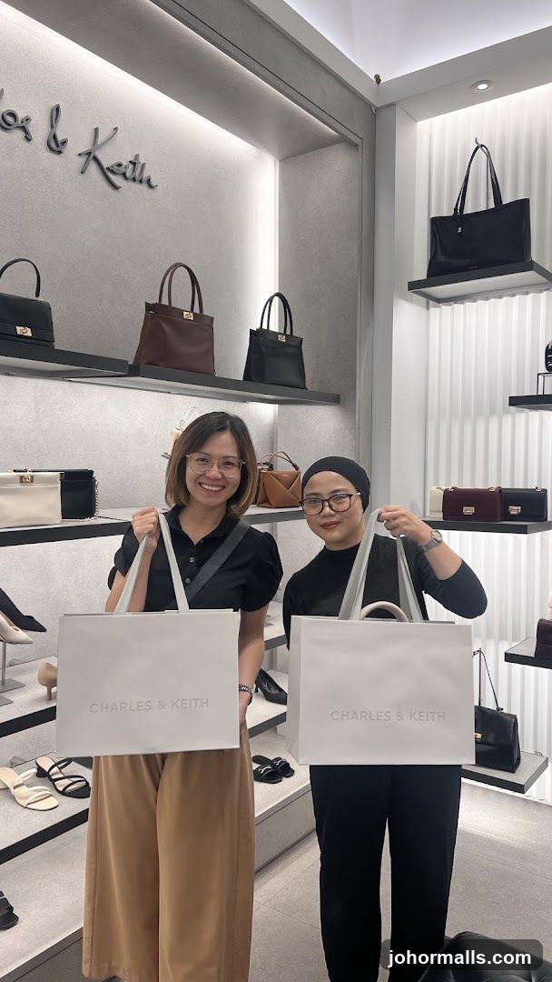 Two Women Holding Shopping Bags