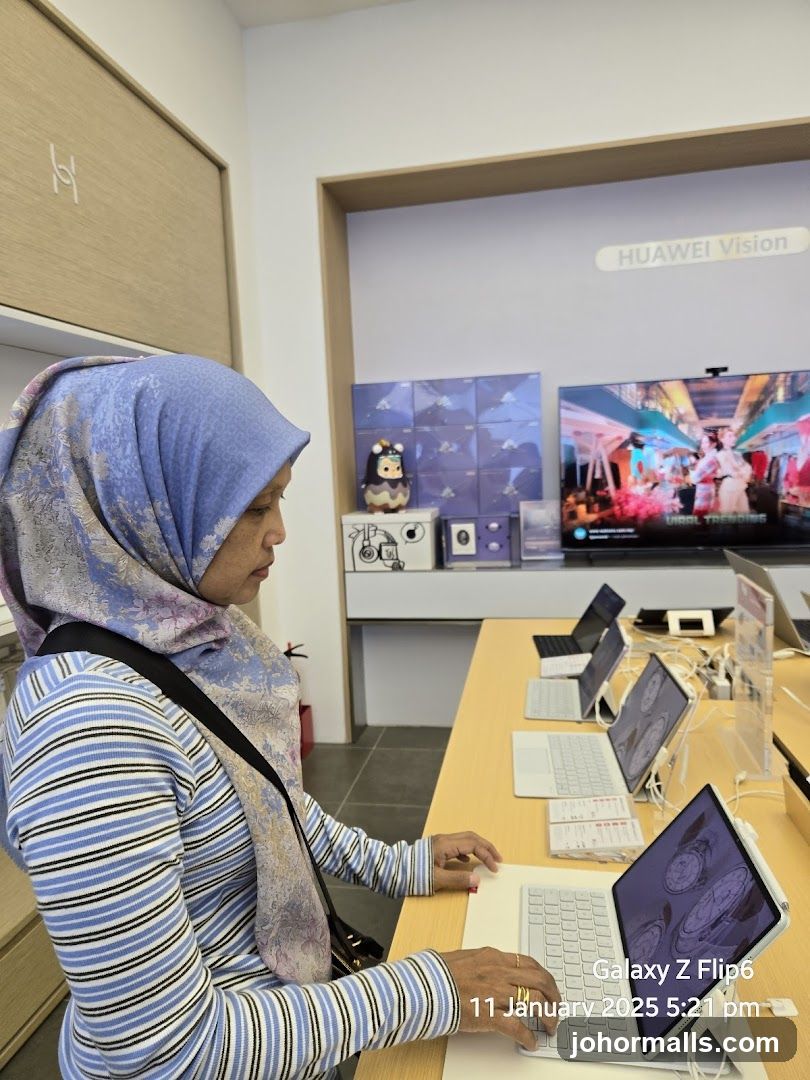 Woman using a laptop in a store