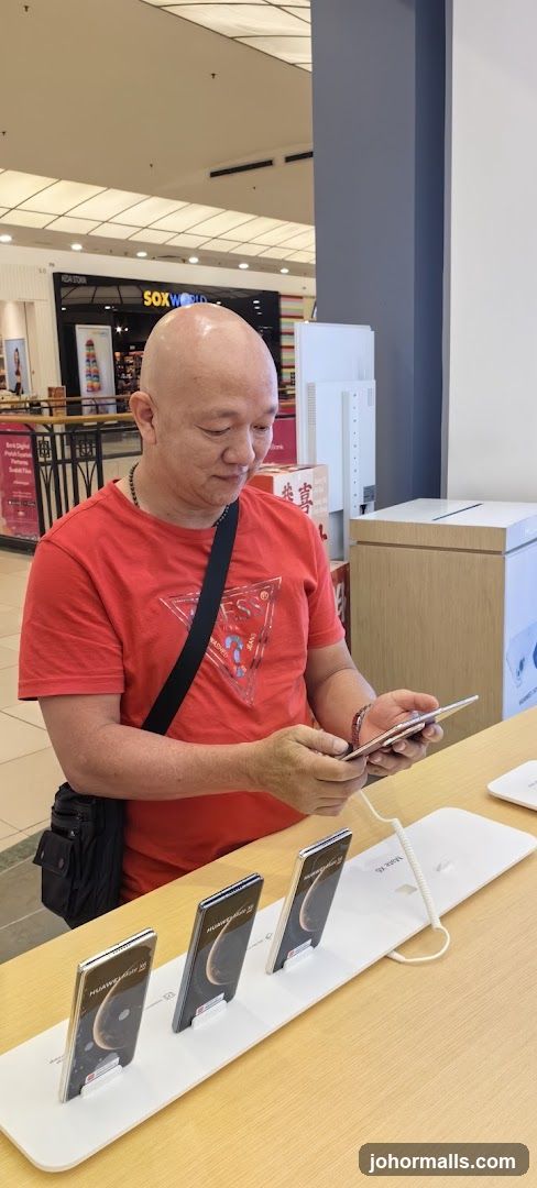 Man examining a smartphone display