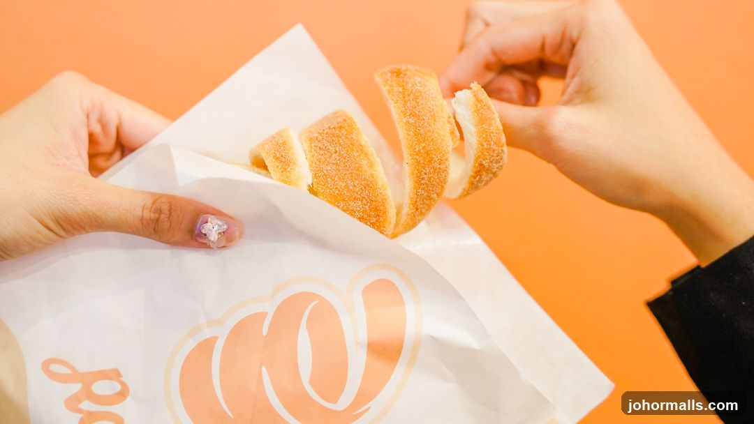 Person holding a pastry