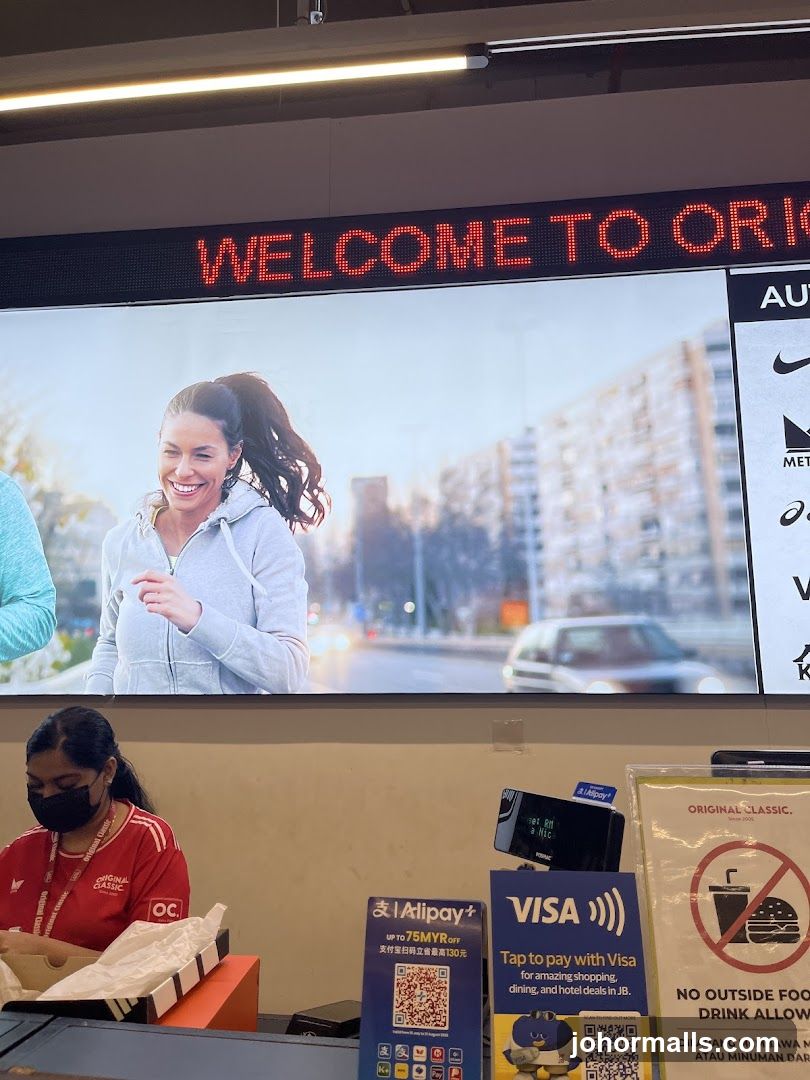 Store interior with digital display and payment terminals