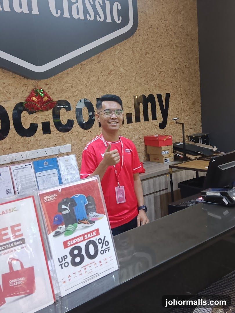 Staff at Counter with Sale Poster