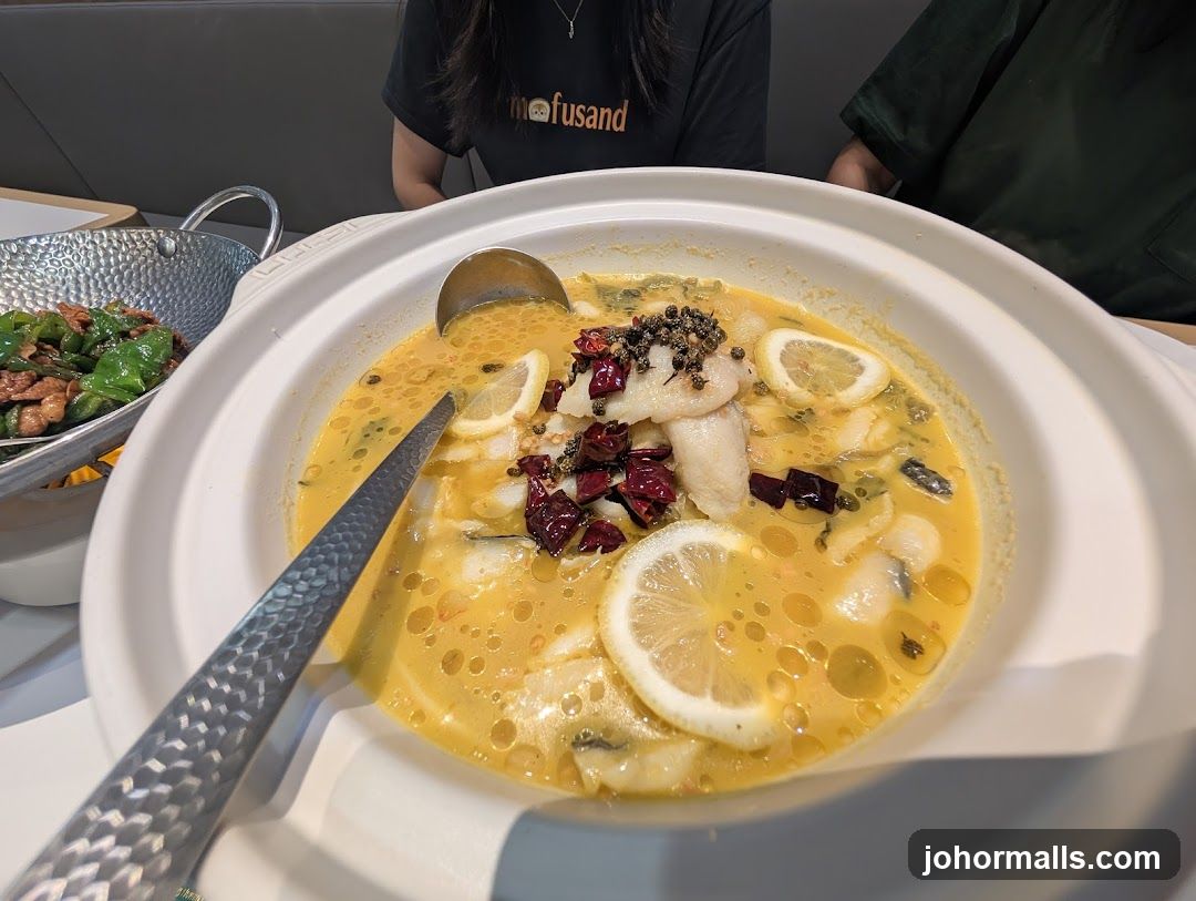 Fish in broth with lemon and chili