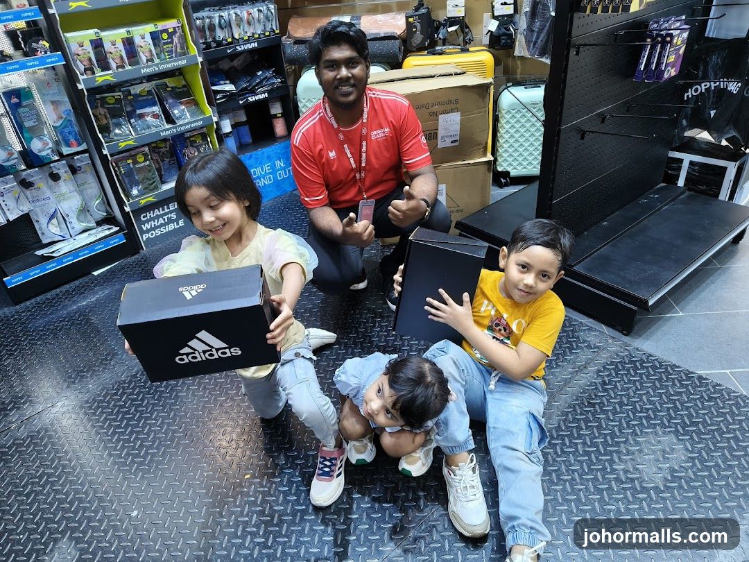 Children with Adidas boxes