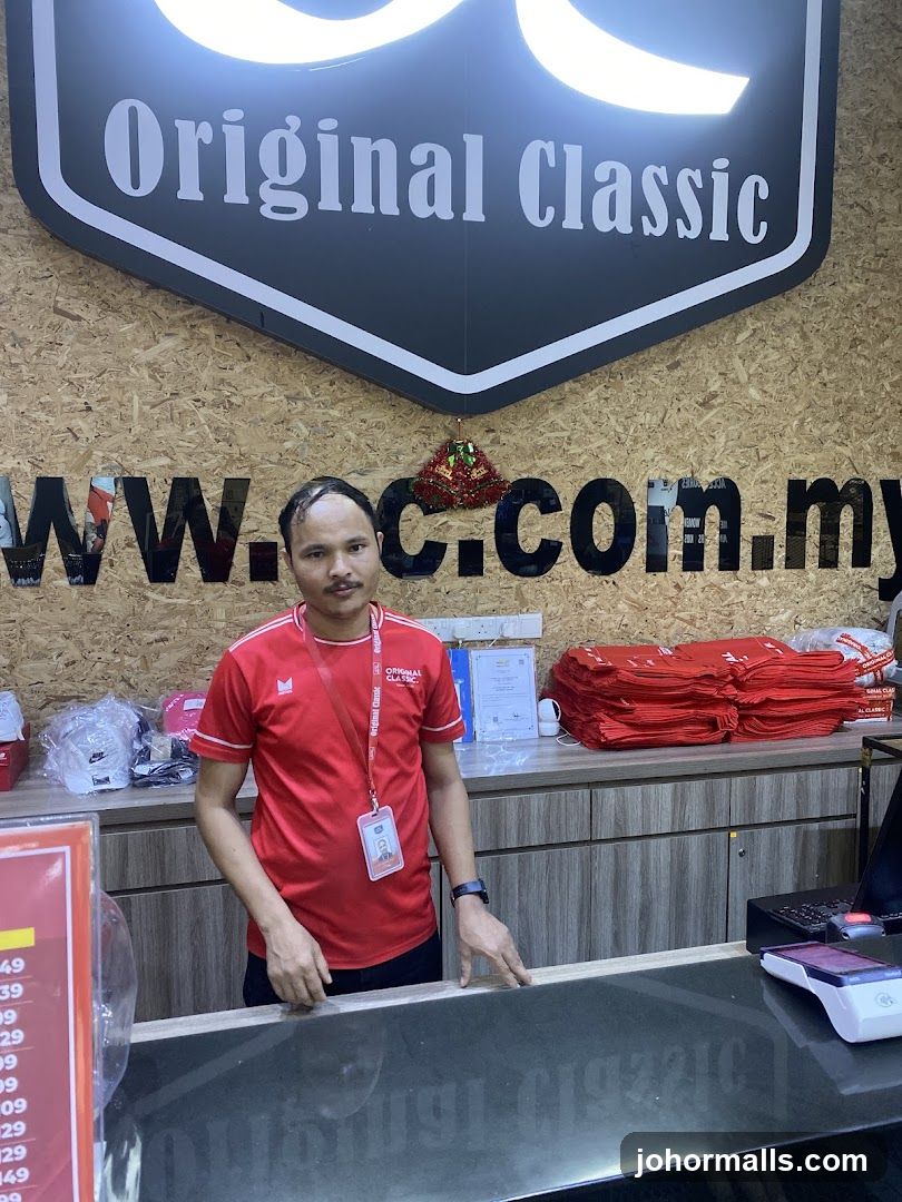 Man in Red Shirt at Counter