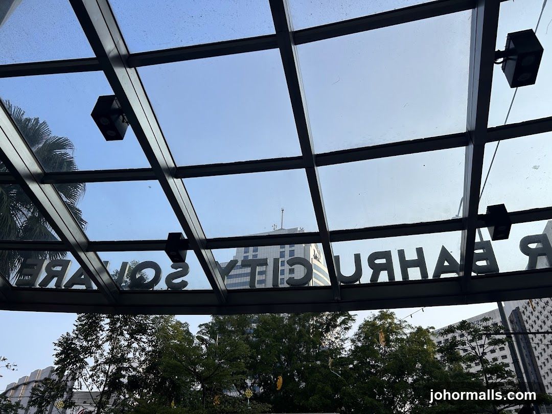 Reflected Signage Under Glass Canopy