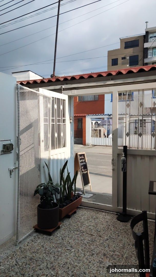 Outdoor cafe entrance with menu board