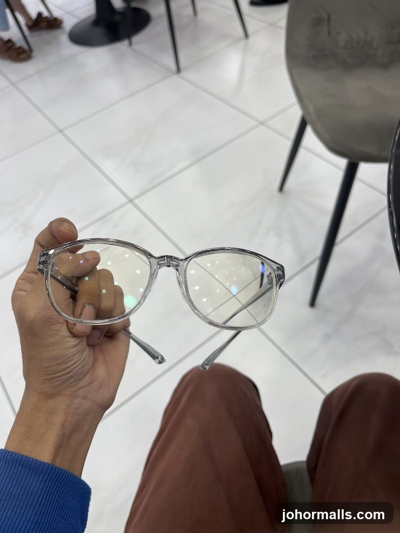 Person holding glasses