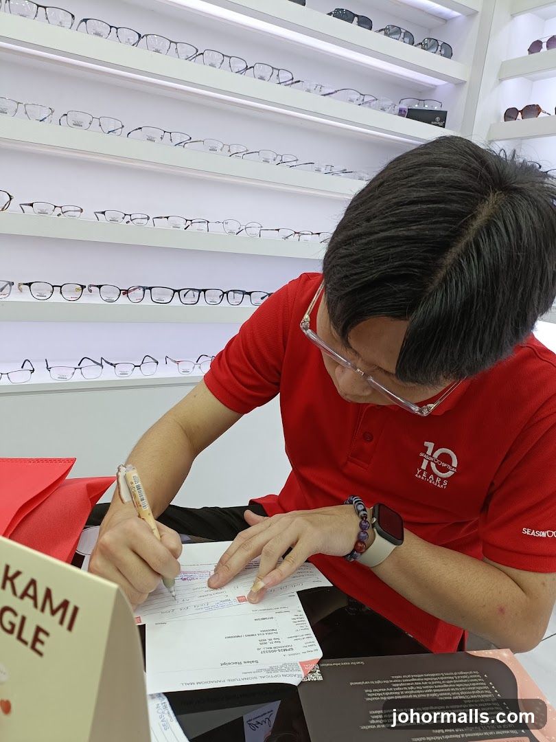 Optician Filling Out Receipt