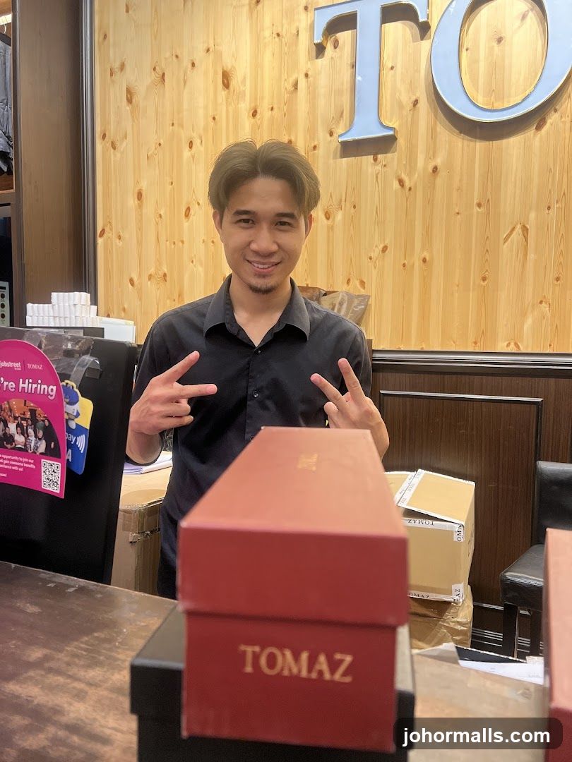 Man in Black Shirt with Boxes
