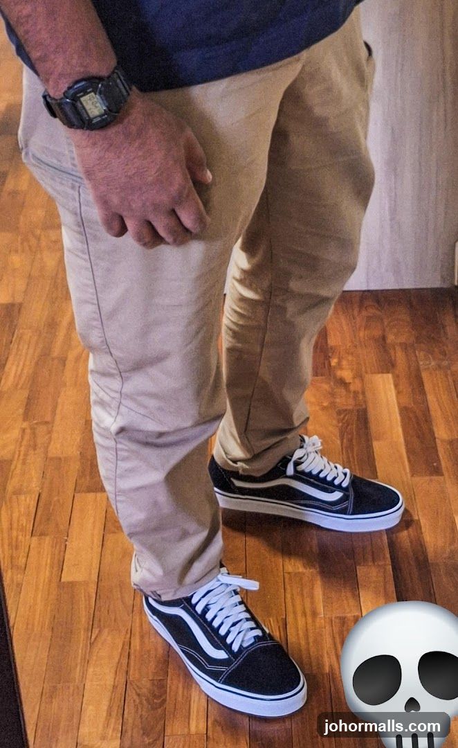 Man wearing Vans Old Skool sneakers