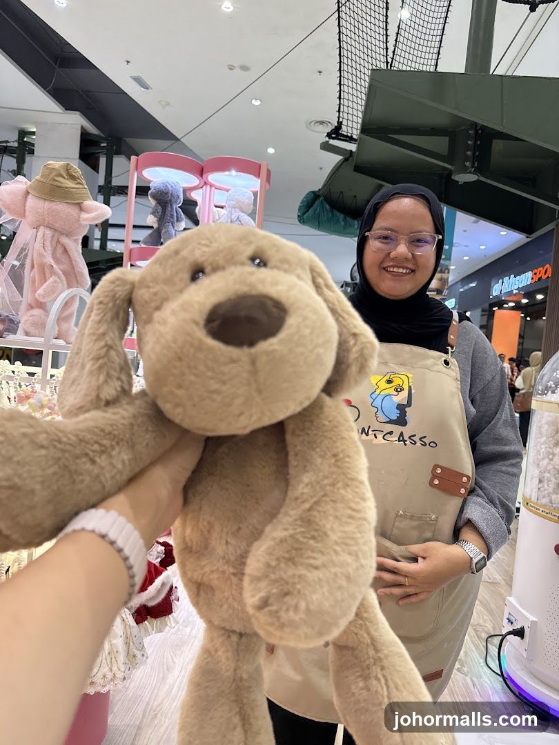 Woman holding a stuffed dog