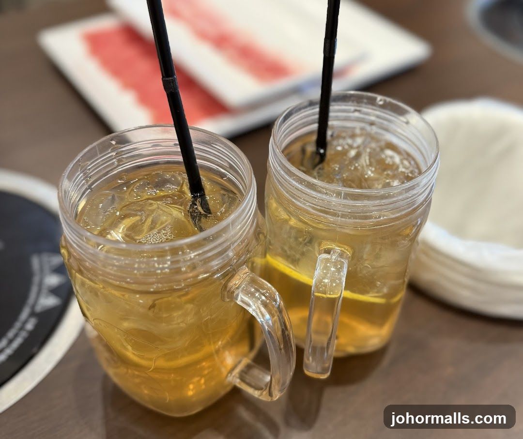 Two iced tea drinks in mason jars