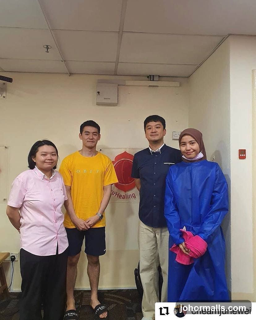 Four people posing for a photo