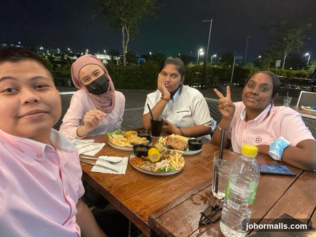 Four friends enjoying a meal at a restaurant