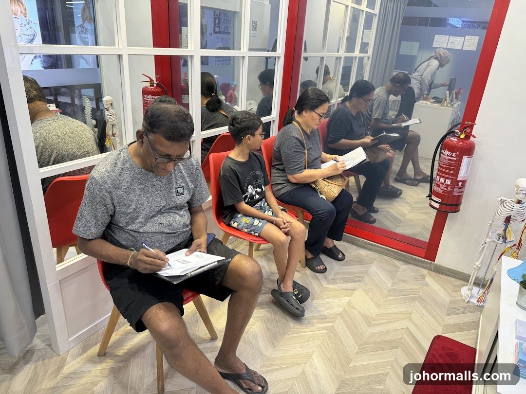People filling out forms in a waiting area