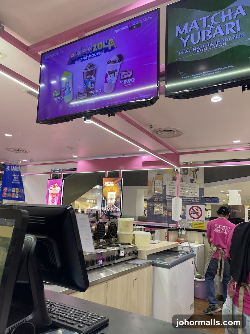 Dessert shop counter with digital menu displays