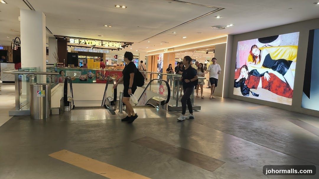 Mall Interior with Escalators and Digital Displays