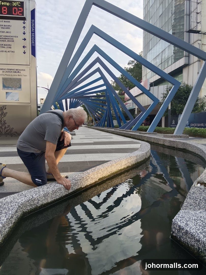 Man by Water Feature