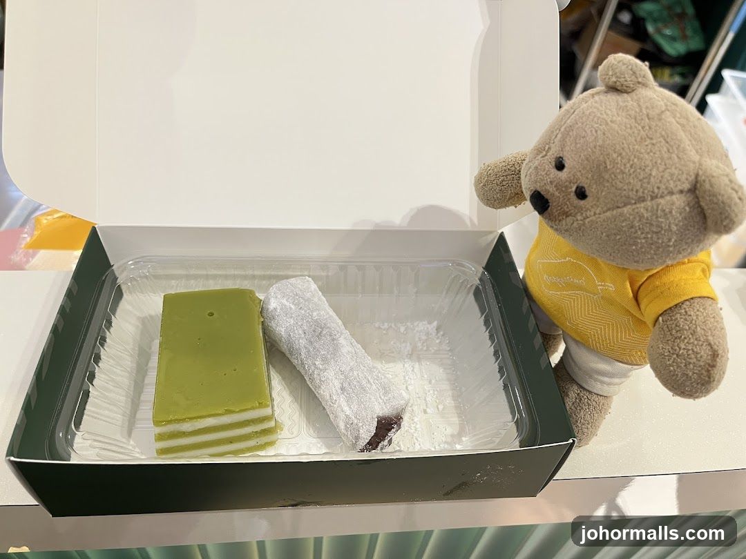Desserts in a box with a teddy bear