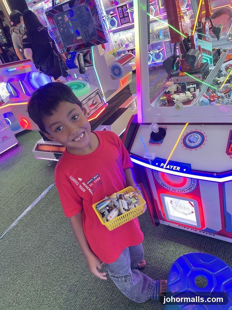 Boy with basket of toys at arcade