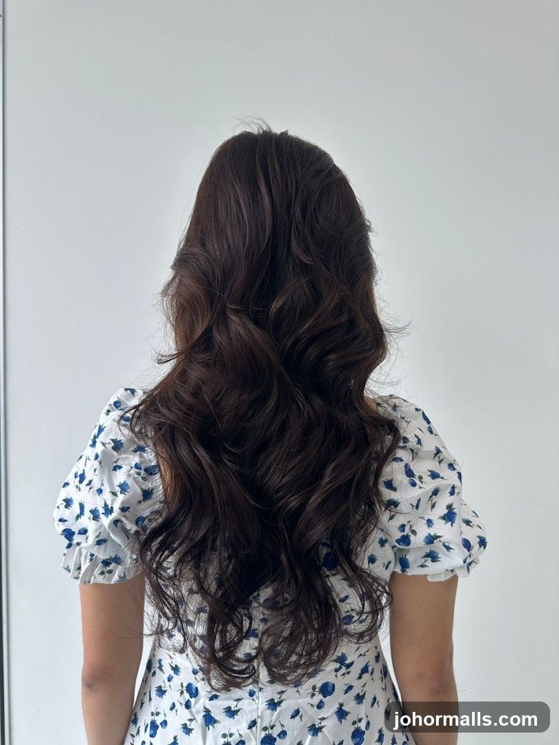 Woman with long, dark, wavy hair
