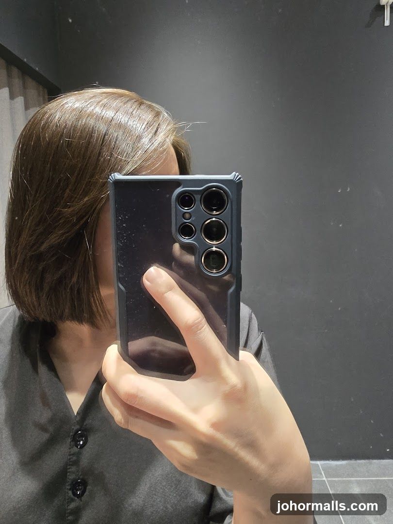 Person taking a selfie in a mirror
