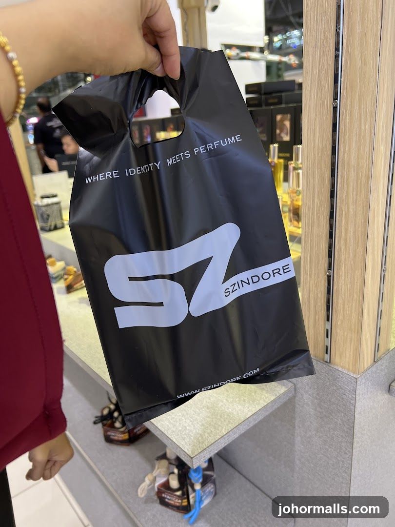 Black shopping bag with brand logo