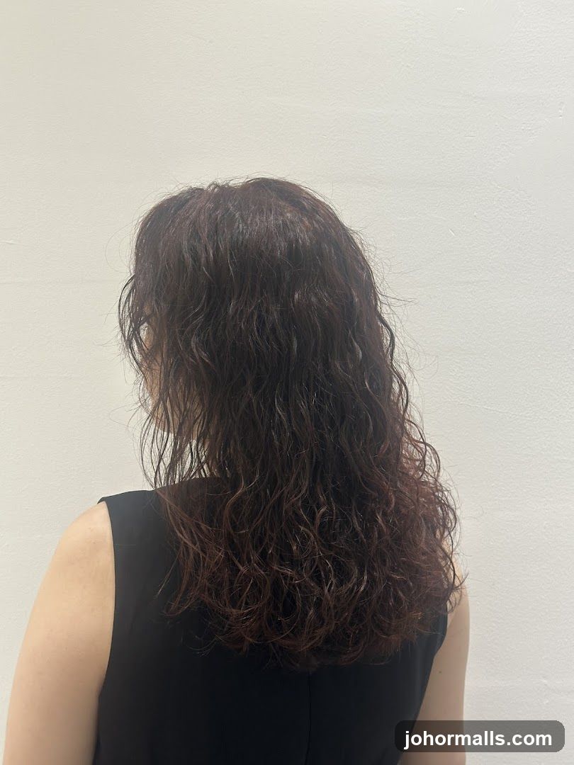 Woman with long, wavy, dark hair