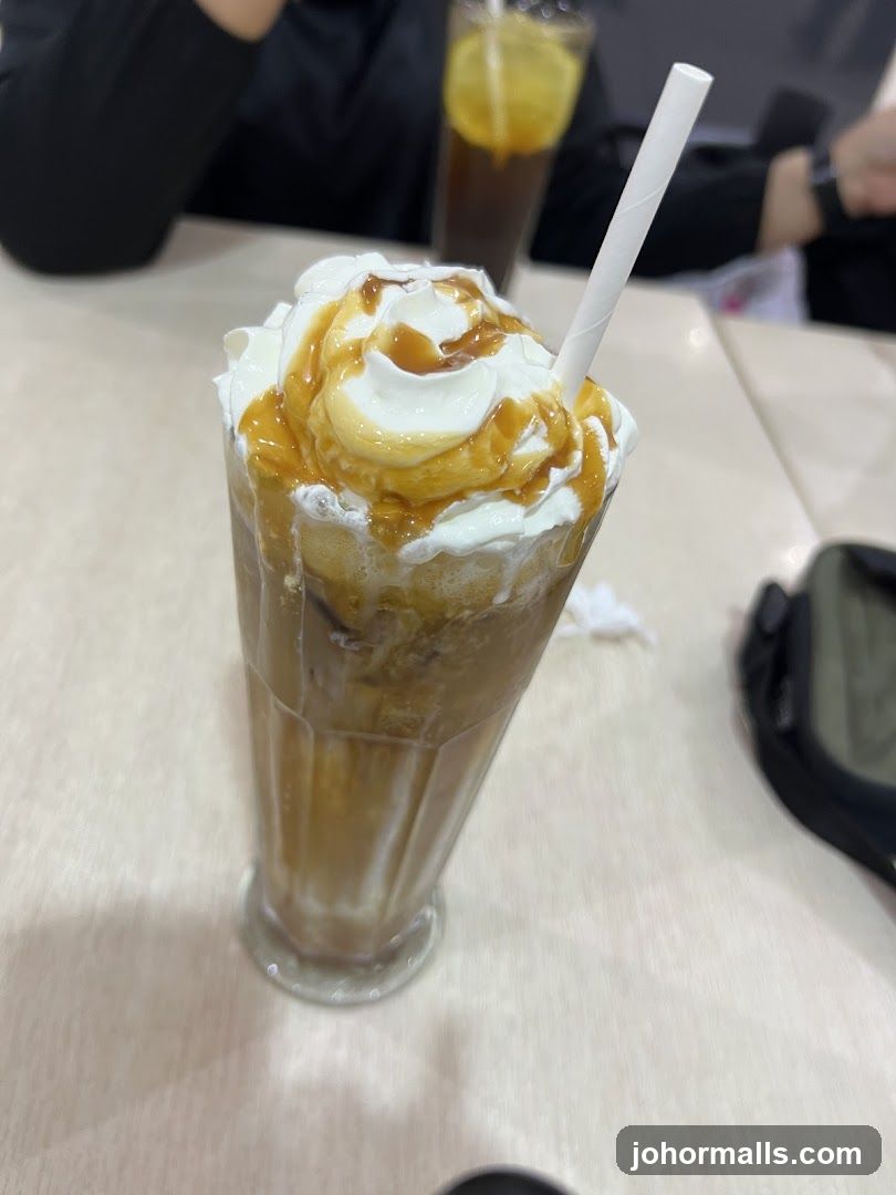 Iced Coffee with Whipped Cream and Caramel Drizzle