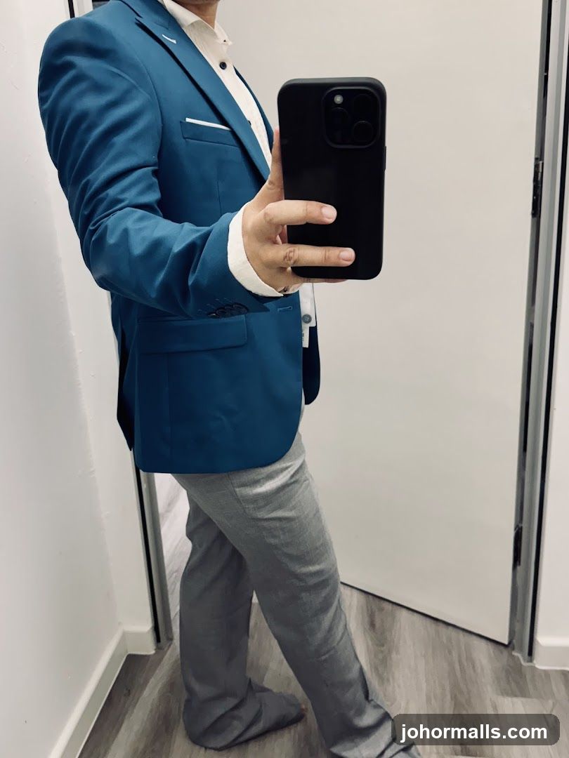 Man in Teal Blazer and Grey Pants