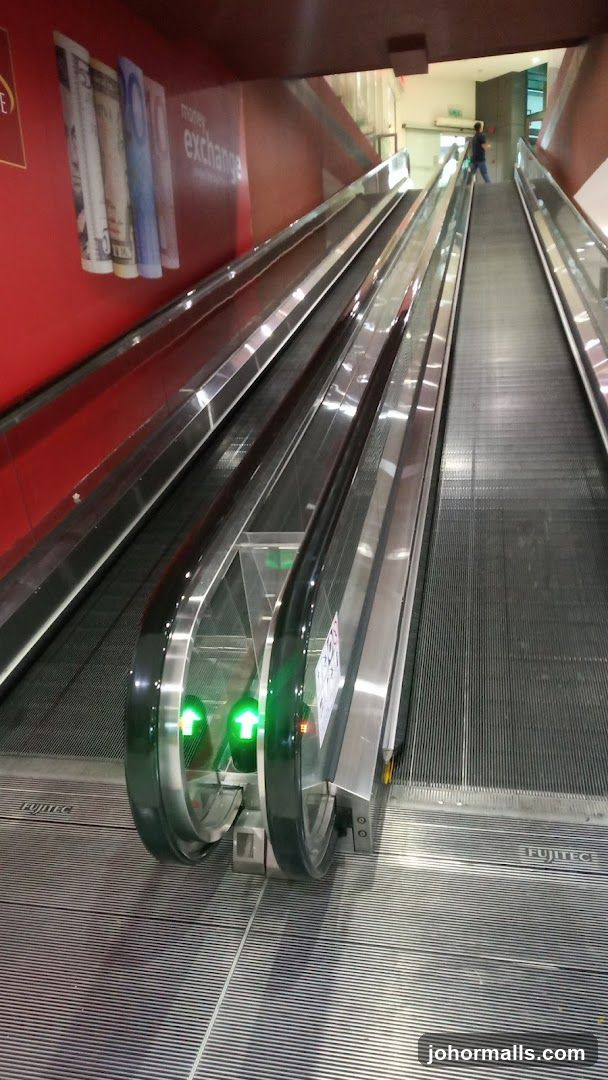 Escalator with Money Exchange Signage