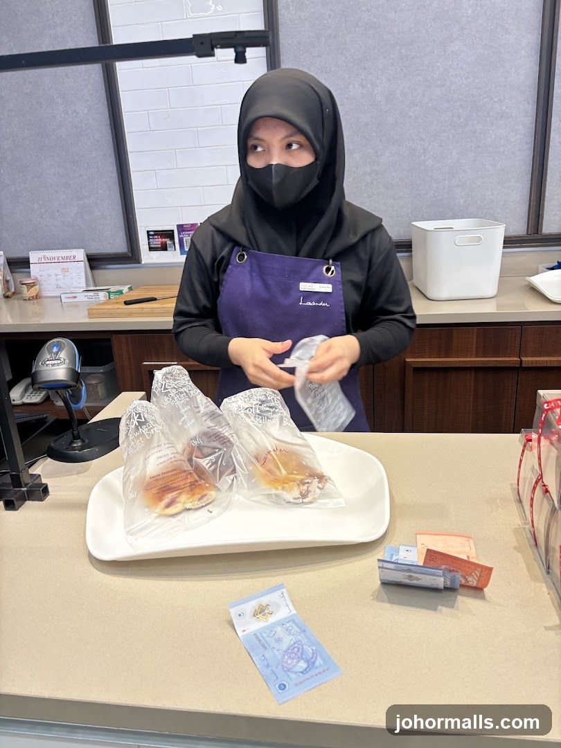 Cashier with baked goods